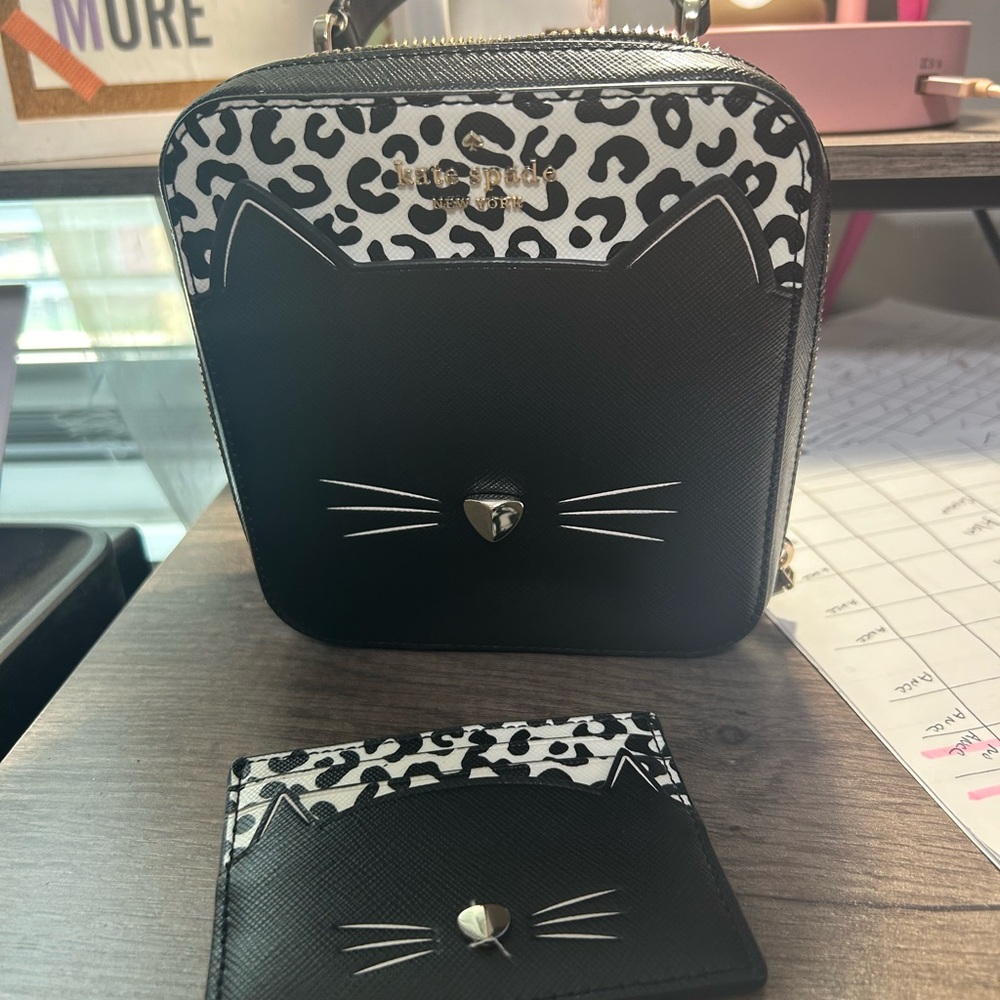 Kate Spade black leather wrist bag